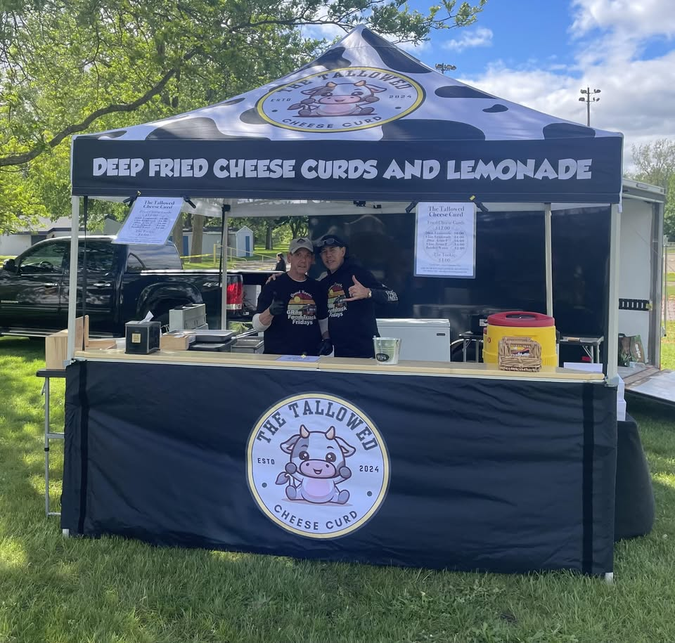 The Tallowed booth at a local event with the crew ready to serve