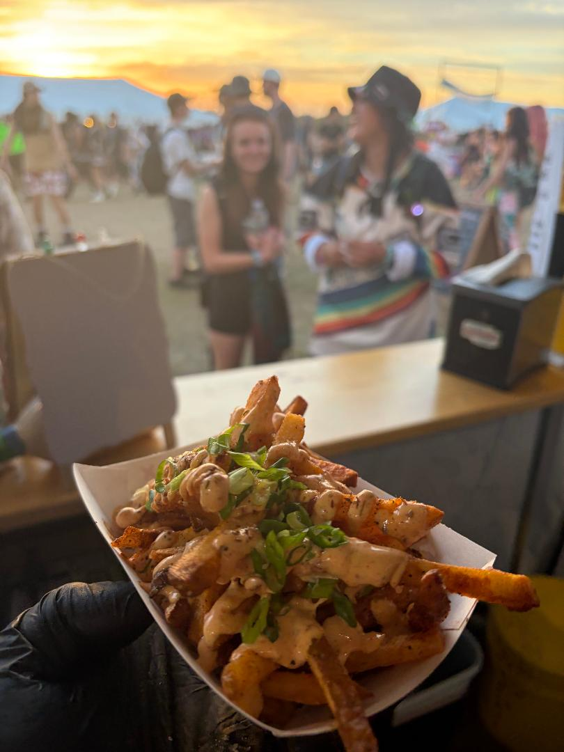 Loaded fries served at a sunset festival